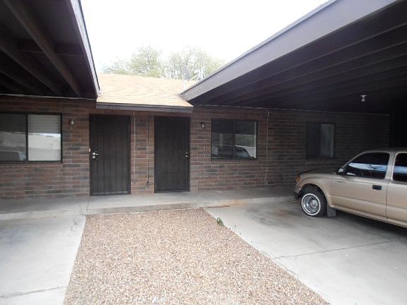 front of unit, 2-car carport & storage