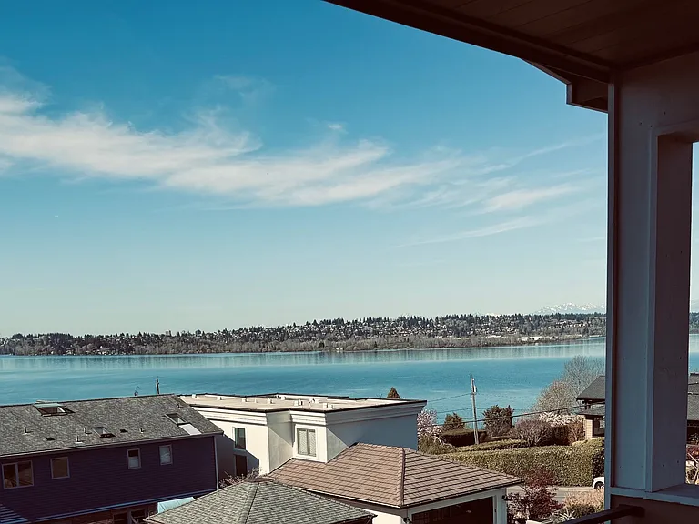 Looking north from the Primary bedroom deck, downtown Seattle and then Mt Rainier are out of frame way to the left of this photo. The views are truly more than 180 degrees wide.
