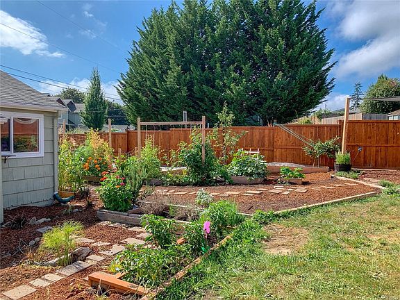 the backyard is landscaped by the owner.