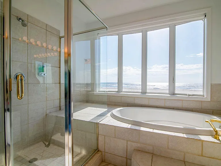 Ocean front master bathroom tub and shower.