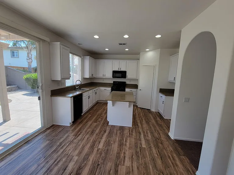 Kitchen with Island and walk-in pantry.