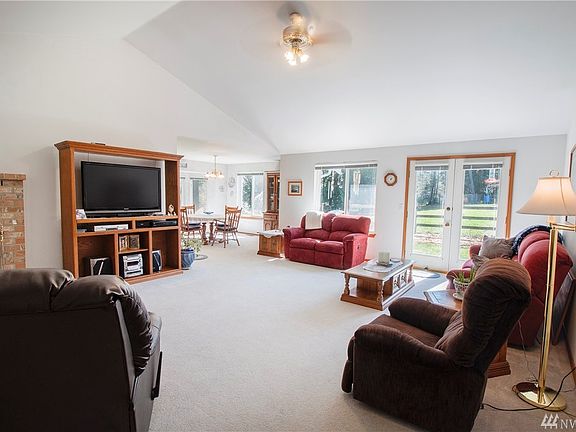 Enjoy the spacious Family Room with wood stove, french doors to the backyard, ceiling fan, and vaulted ceilings