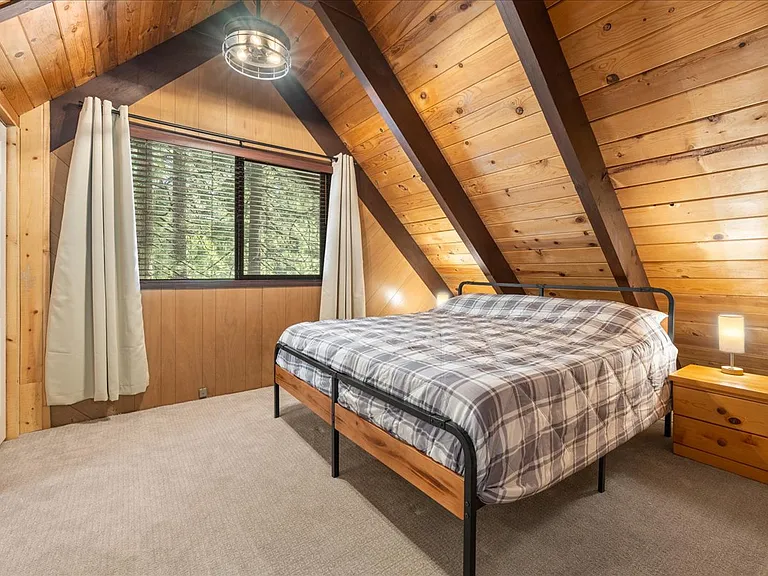 King size bed with memory foam mattress, black out curtains, full length mirror, & on suite bathroom.