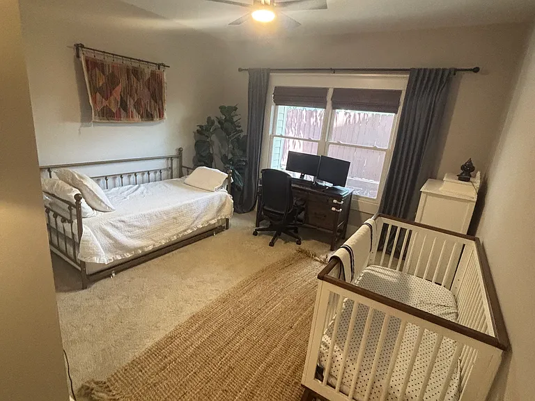One of two bedrooms downstairs.