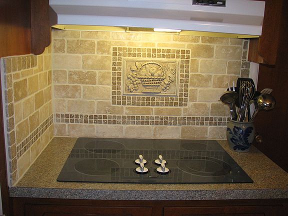 Custom tumbled marble backsplash; new appliances