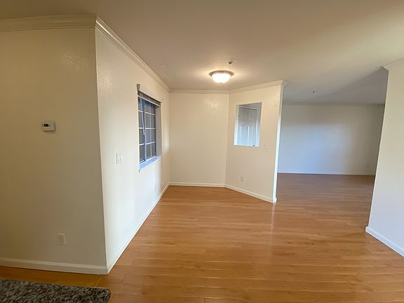 Open floor plan with beautiful wood flooring.