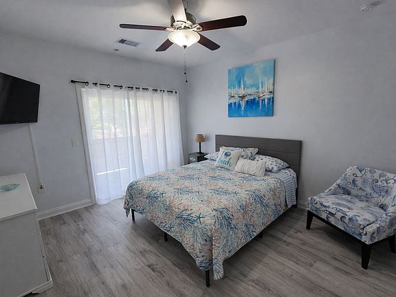 Main bedroom with sliding doors to the covered patio