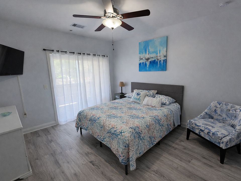 Main bedroom with sliding doors to the covered patio