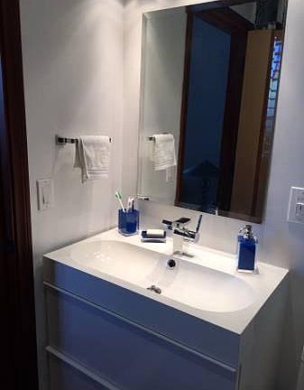 Updated bathroom with bath tub