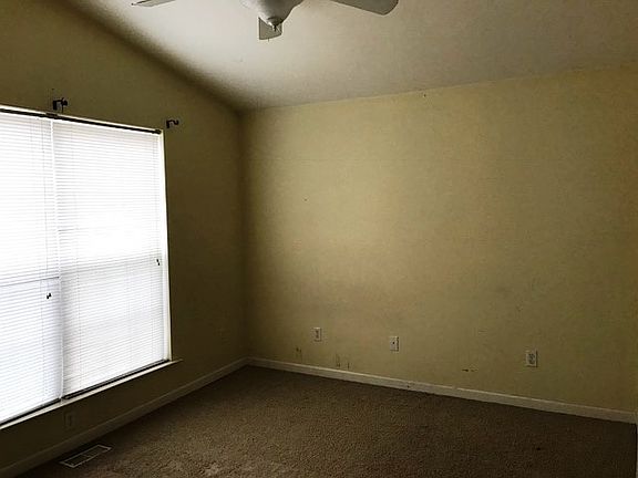 Front bedroom (w/ closet and bathroom access).