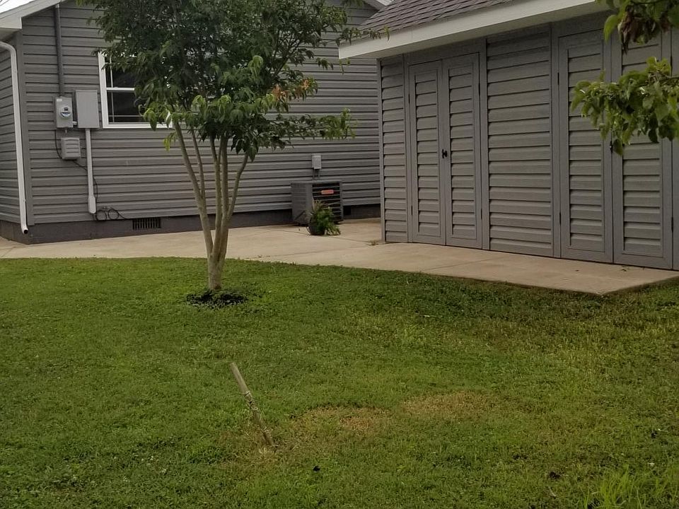 Backyard with patio and storage building
