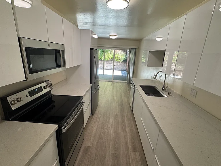 Kitchen facing backyard patio.
