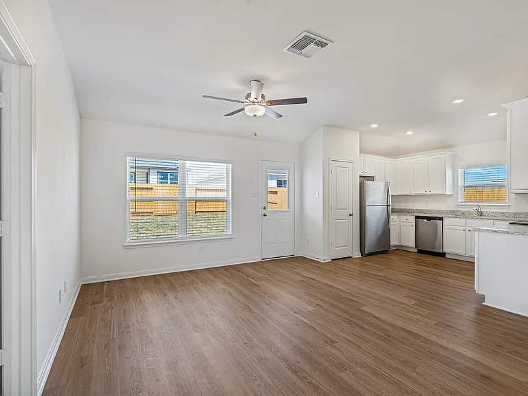Main living area with vinyl flooring.
