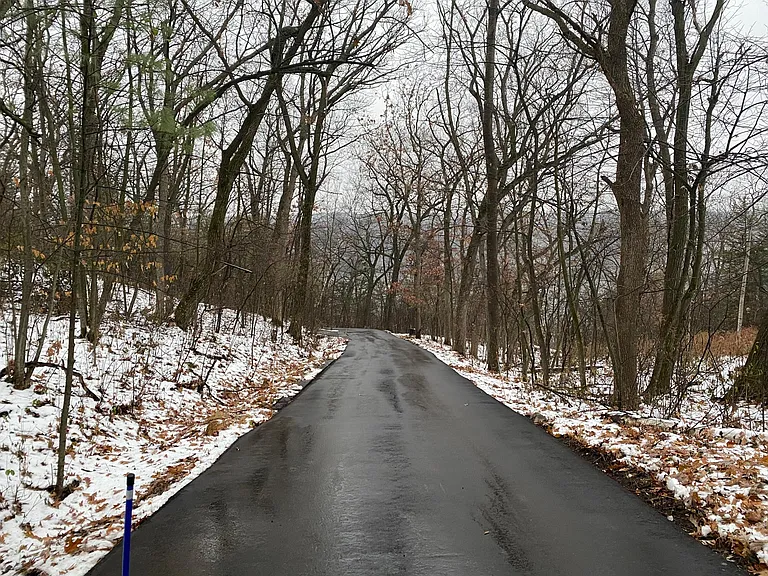 Paved drive (835th Ave) down to access road to house