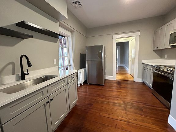New Kitchen with stainless appliances and microwave