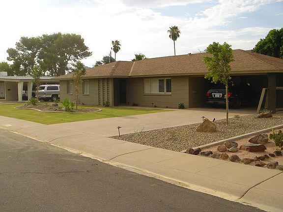 Front Yard after landscape redesign (house also painted)
