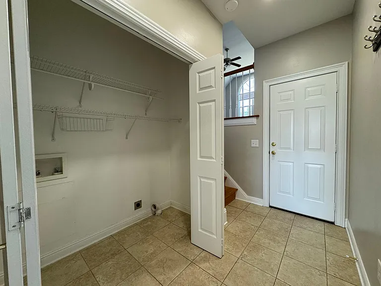 View of Laundry Room -Bonus room Upstairs and the closed door leads to the Garage