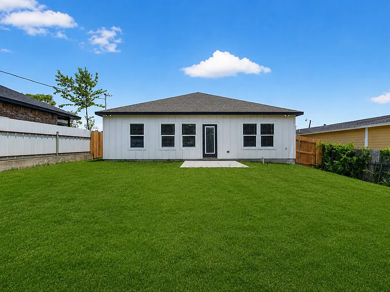 Large backyard with concrete patio