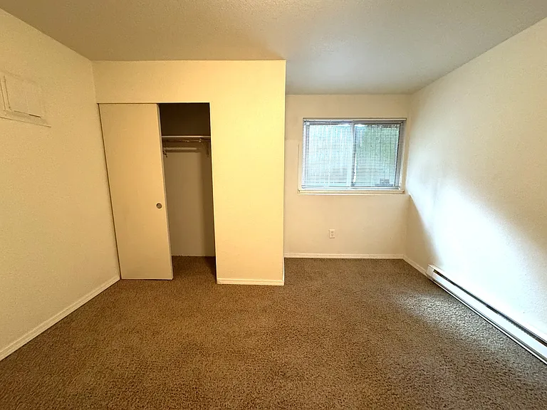 Bedroom with storage closet