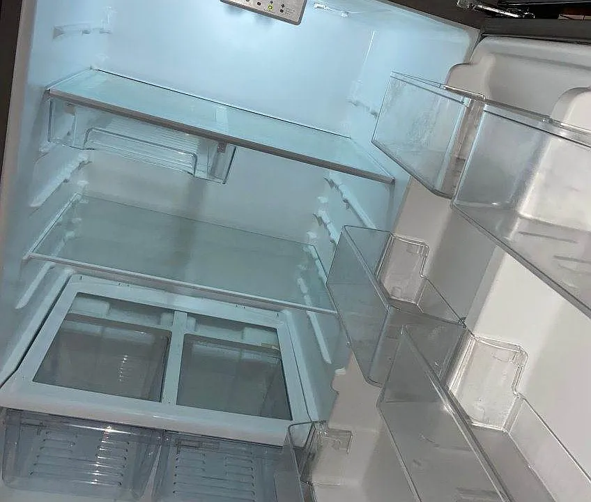 Inside of professionally cleaned stainless steel refrigerator
