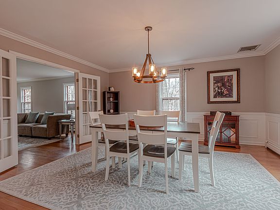 Formal Dining Room with French Doors opening to the Living Room