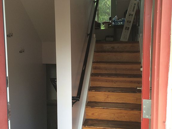 Entrance door and stairs to living room