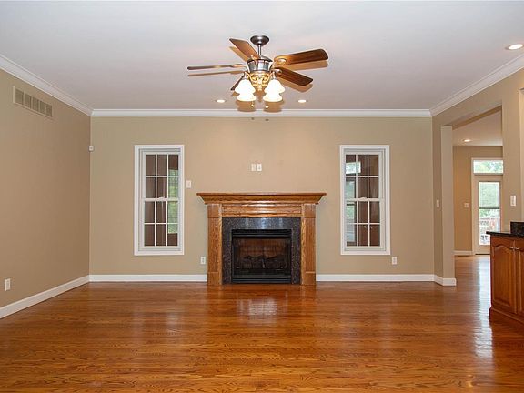 The 18 x 18 living room 9'ft ceilings, crown moulding and vent free gas fireplace.