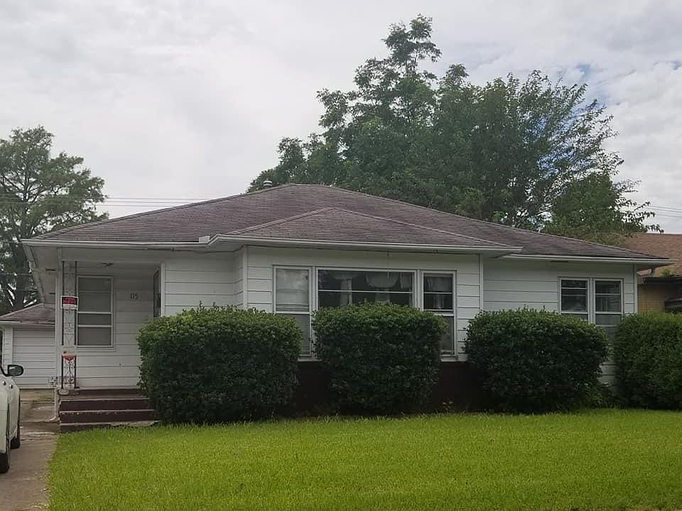 Outside front. One car detached garage at the end the of driveway. The roof is scheduled to replaced. Should be done before school starts. The rain has slowed the timing down.