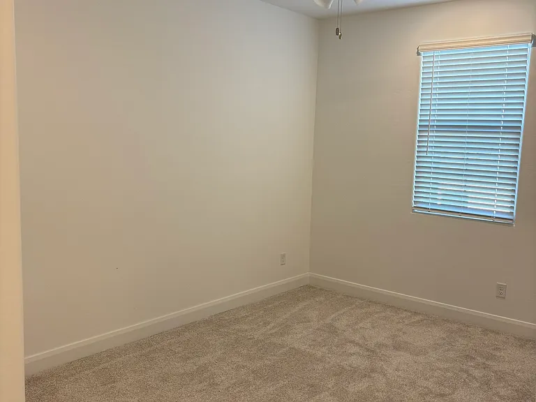 Each bedroom has a ceiling fan and a closet