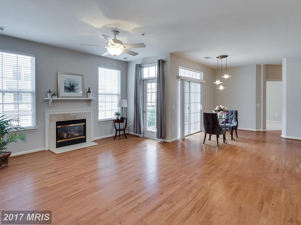 LIVING ROOM WITH FIREPLACE AND DINING ROOM