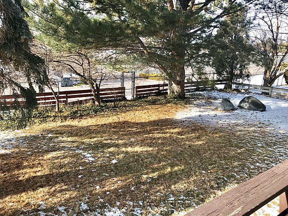 Backyard with fence to Holt 