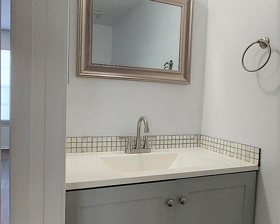 LIVING ROOM: Guest Half-Bathroom with all new fixtures, vanity and hardware