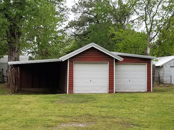 Detached garage with carport