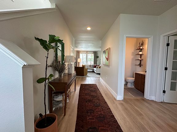 Foyer, half bath, and entrance to office