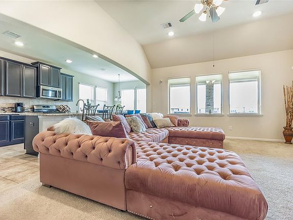 Light & Bright open concept family room with lots of windows to look out to the park.