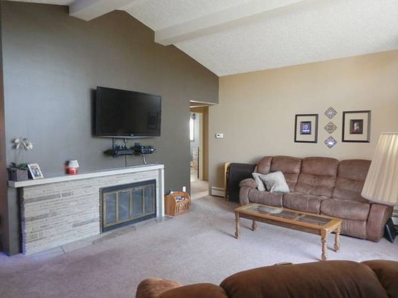 Gas log fireplace in an oversized comforting living room