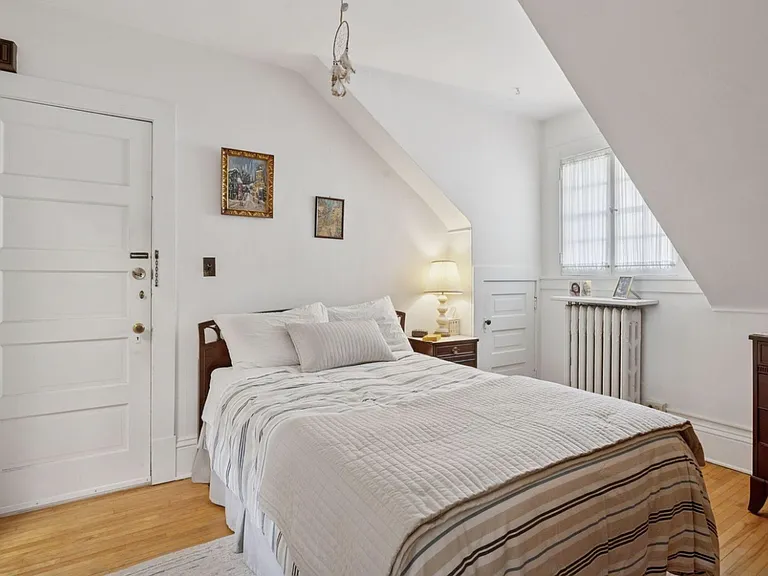 First look at bedroom, with enough space for a king bed, dresser, yoga mat, small desk, etc. West facing window provides gorgeous sunset lighting in the evenings, and soft indirect light in the mornings. Door provides access to garage and private entrance