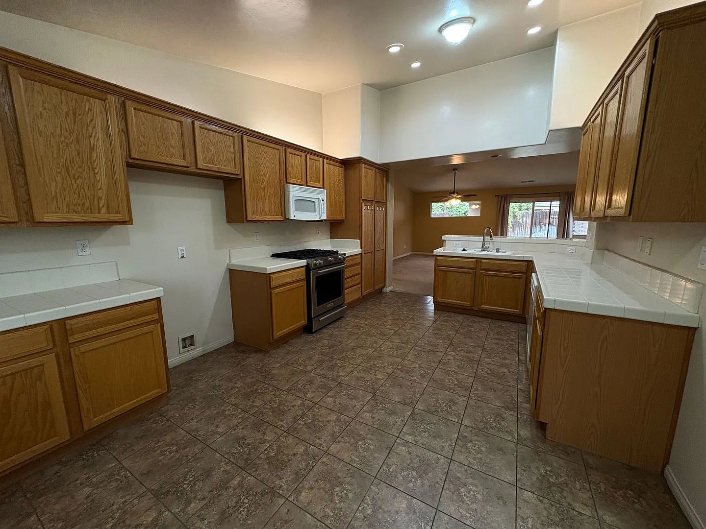3 Bedroom Home with 2-Car Garage, Covered Patio & Gardening Included — Photo 4