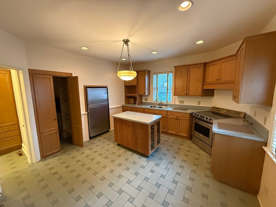 Kitchen with gas stove, lots of storage, dishwasher, fridge, and more!
