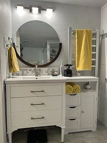 Mid century modern vanity has soft close drawers and luxury hardware. 
 (small drawer unit not included)