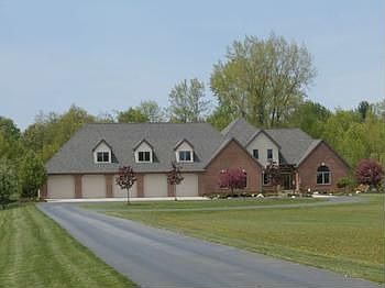 This spectacular executive home has something for everyone.  Situated on 6.1 acres, this 5,120 square foot home, has two main floor private bedroom suites, three, 2nd floor bedrooms with onsuite and jack and jill baths, custom cherry kitchen with granite counters, spacious eat in area, a sunroom that over looks the backyard and the in ground, salt water, heated 8' deep swimming pool, 4 entertaining areas in the fully finished basement, custom gym, 3 zoned heating system, 10 car, heated garage, generator, reverse osmosis system, 2 acres of invisible fencing and city water at the road. Additional acreage is available also and buyer to assume the water assessment. Call for your personal showing today!