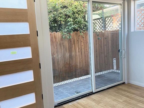 The living room has huge sliding glass doors