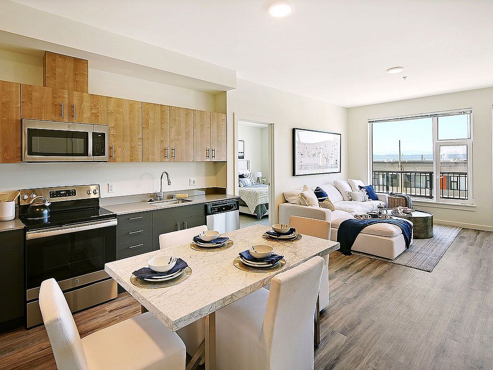 Experience coastal living in style with this open-concept space featuring ocean views and modern finishes.