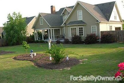 Back Yard
						:
						Landscaped fenced in back yard with natural areas, trees, and flowering shrubs