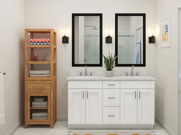 Primary bath with chrome fixtures and black-framed mirrors