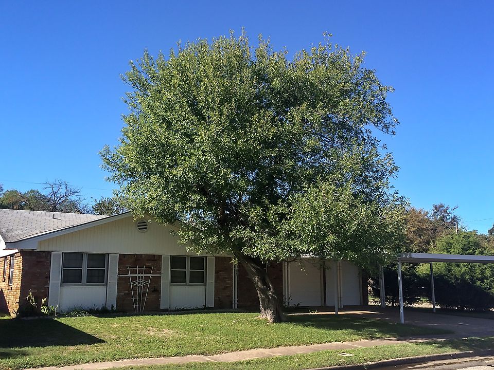 Corner lot with trees.