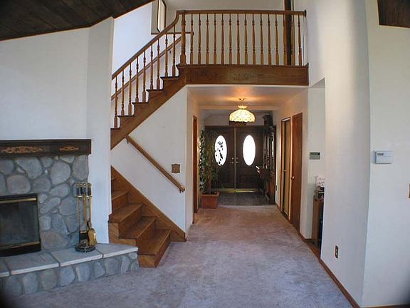 Fireplace and Oak Stairway