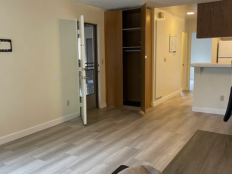 Carport Entrance with Washer/Dryer in Outdoor Closet