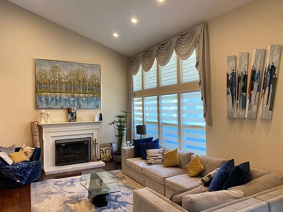 Formal and upgraded fireplace with amazing windows