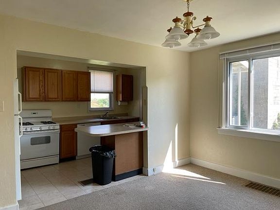 Open kitchen to dining room with lots of natural light.